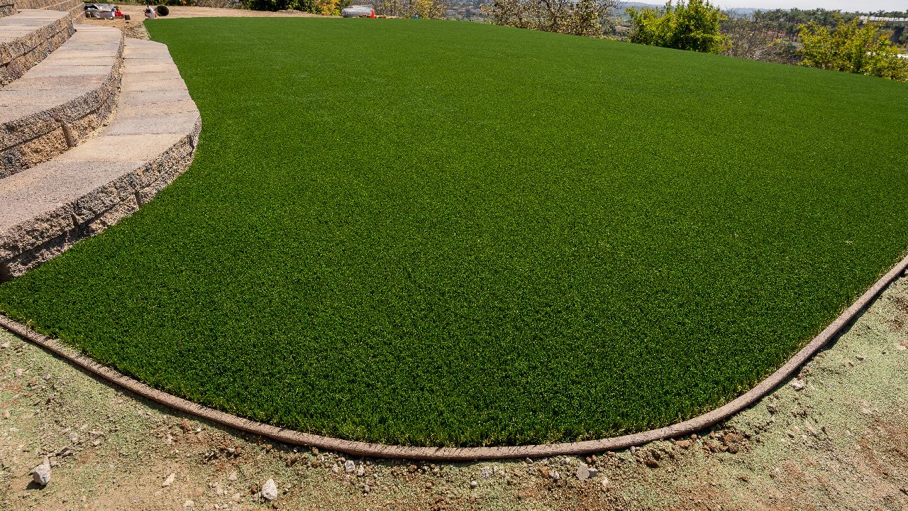 a photo of a newly-installed synthetic grass lawn